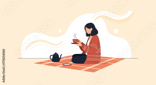 Woman Enjoying Tea On A Blanket: A Moment Of Serenity And Peaceful Relaxation