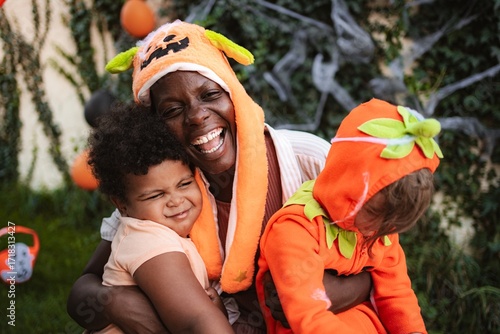 Happy african american family celebrating Halloween together