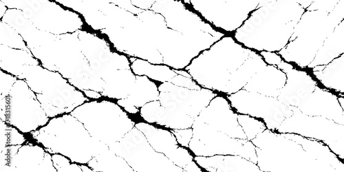 The dry, cracked mud texture of an old, broken earth wall is a rough, abstract pattern