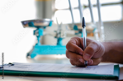 Hand of a man signing a document paper, insurance, legal contract or lawyer consulting. Disability people, attorney or advocate in negotiation, policy advice or accident report closeup