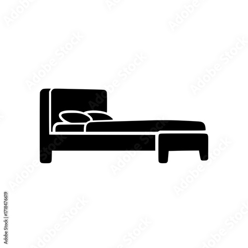icon of a modern bed with headboard and pillows in black silhouette.