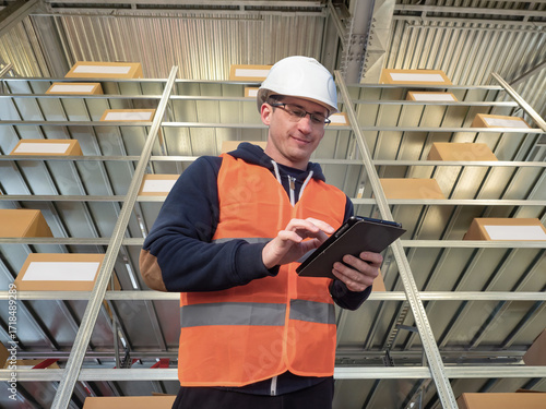 Young warehouse worker. Man...