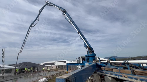 Cement truck in new development real estate property.Over 10,000 multi-residential projects are in the design or construction phases in Australia in 2024 report.