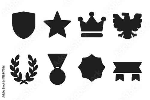 Honor Emblem Icons. Solid, filled icon set of honor emblems: shield, star, crown, eagle, laurel wreath, medal, badge, ribbon. Solid, filled icons in only black