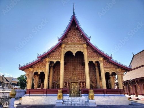 Wallpaper Mural Ornate Buddhist Temple in Luang Prabang – Golden Lions and Traditional Architecture Torontodigital.ca