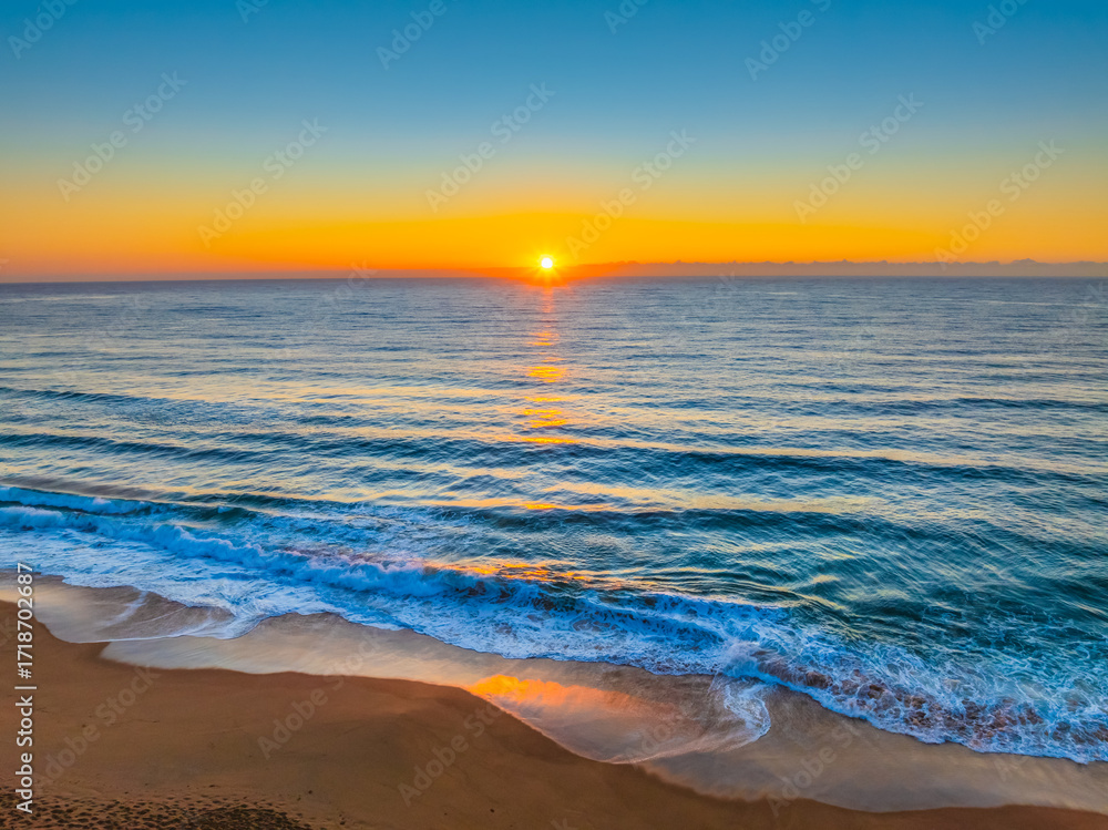 Fototapeta premium Sunrise at the Seaside with Clear Blue Skies