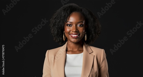 Smiling businesswoman portrait, professional headshot, corporate woman, African American model, beige blazer, dark background, studio shot, happy expression, confident, successful, female executi