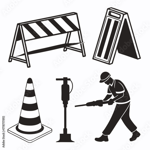 Construction worker with jackhammer and traffic cones