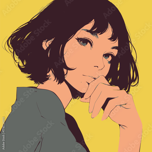 A young woman with short dark hair and striking features poses with her hand near her face.