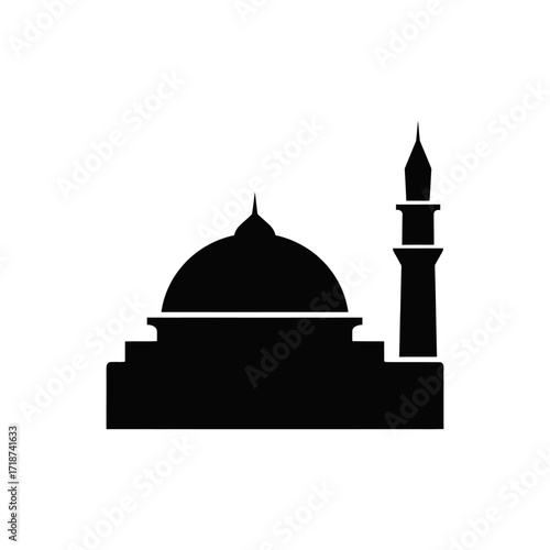 Mosque stands tall with its minaret against a clear sky, symbolizing faith and architectural beauty in a serene atmosphere.