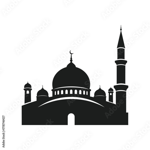 Silhouette of mosque stands tall against clear sky, showcasing islamic architecture with minarets and dome in serene atmosphere.