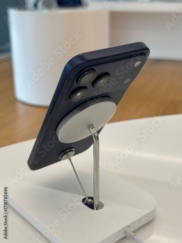 Ho Chi Minh City, Vietnam 21 Sep, 2025 – iPhone 17 series showing the back sit on the magsafe charger