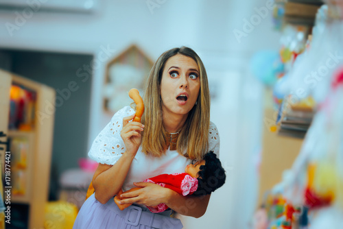 Woman Breaking a Toy in a Store Feeling Remorseful. Mom shocked by the low quality of the plastic kids products on sale
