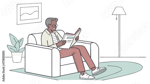 An elderly Black man with glasses sits comfortably in a plush armchair, engrossed in reading a book in a well-lit room.