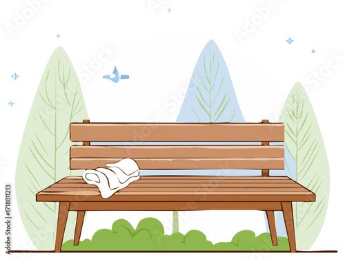 Empty wooden park bench with a folded cloth in a peaceful natural setting