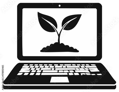 Laptop with growing plant sprout on screen symbolizing green technology and sustainability