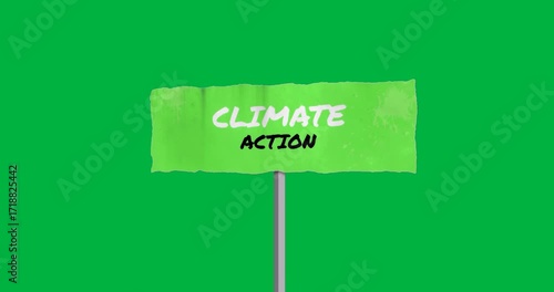 climate protest sign swaying on metal pole featuring bold text and speckles on transparent backdrop
