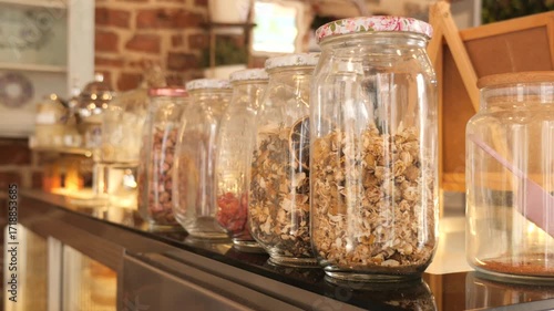 Wallpaper Mural Jarred spices and herbs displayed in a cozy cafe Torontodigital.ca