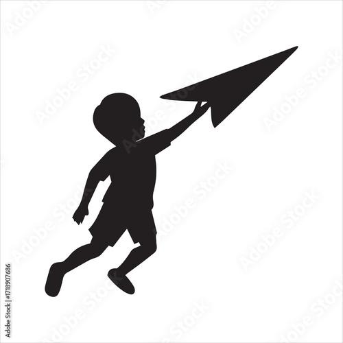 Silhouette of a child throwing a paper airplane into the sky