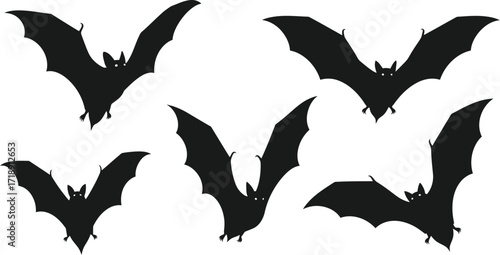 Spooky black bat silhouettes flying on a white background for halloween designs