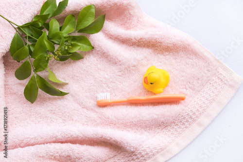 toothbrush with terry cloth health care of baby arrangement flat lay style on background white 