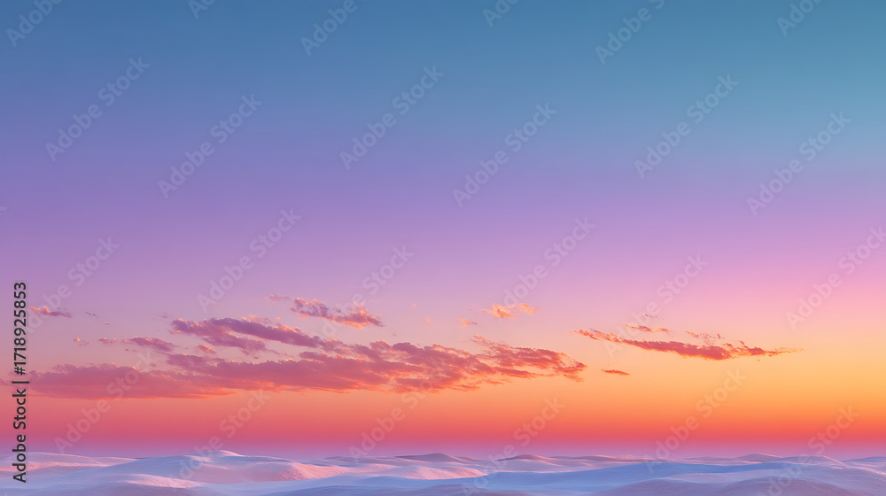 Fototapeta premium Vibrant sunset sky with soft pink and orange clouds over a tranquil ocean horizon