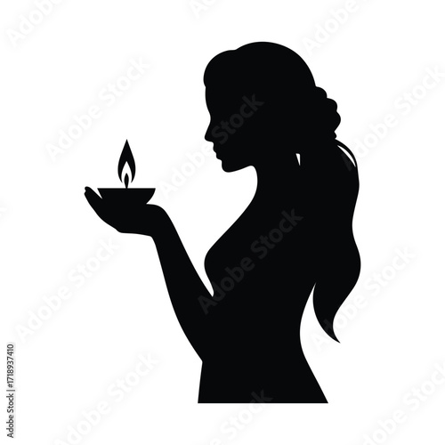 Silhouette of a woman holding a candle artistic representation of hope and faith