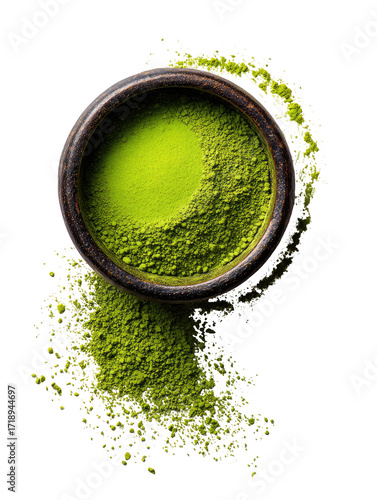 Green powder in a wooden bowl, scattered