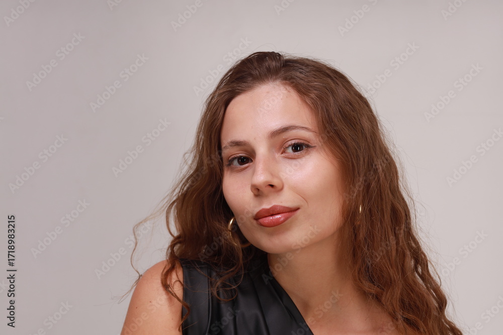 Fototapeta premium Close studio portrait of pretty young brunette woman