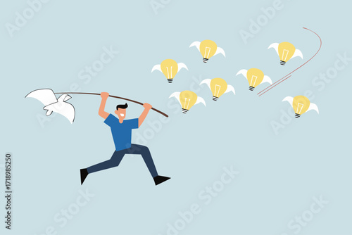 Capture new business ideas, businessman hunts and catches ideas to fly light bulbs with butterfly net.
