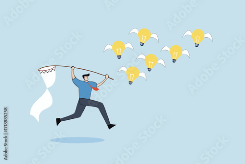 Capture new business ideas, businessman hunts and catches ideas to fly light bulbs with butterfly net.