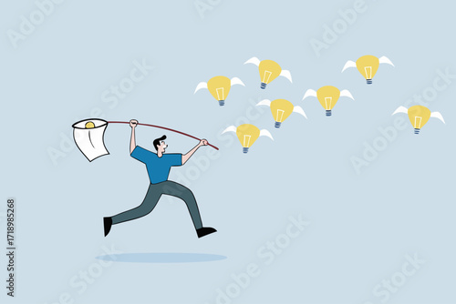 Capture new business ideas, businessman hunts and catches ideas to fly light bulbs with butterfly net.