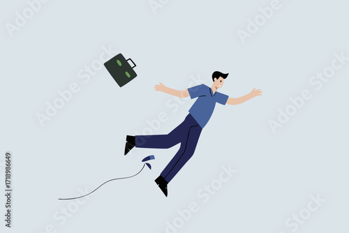 clumsy businessman tripping over power cord electrical plug that fell to the floor.