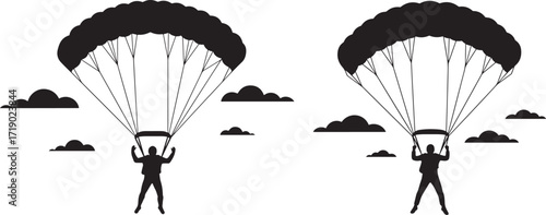 Two parachutists descending silhouette