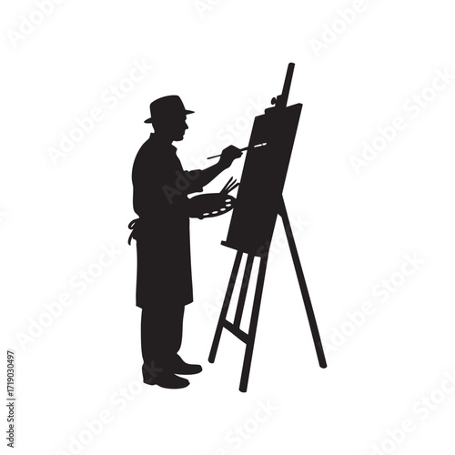 Silhouette of male artist painting at easel with palette