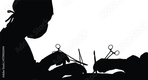 Silhouette of surgeons performing an operation with surgical tools in a sterile environment on white background