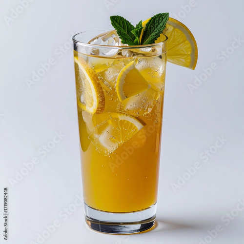 A tall glass of refreshing yuzu juice with ice and a lemon slice. 