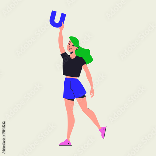 Young woman holding up a blue letter U, symbolizing unity or understanding