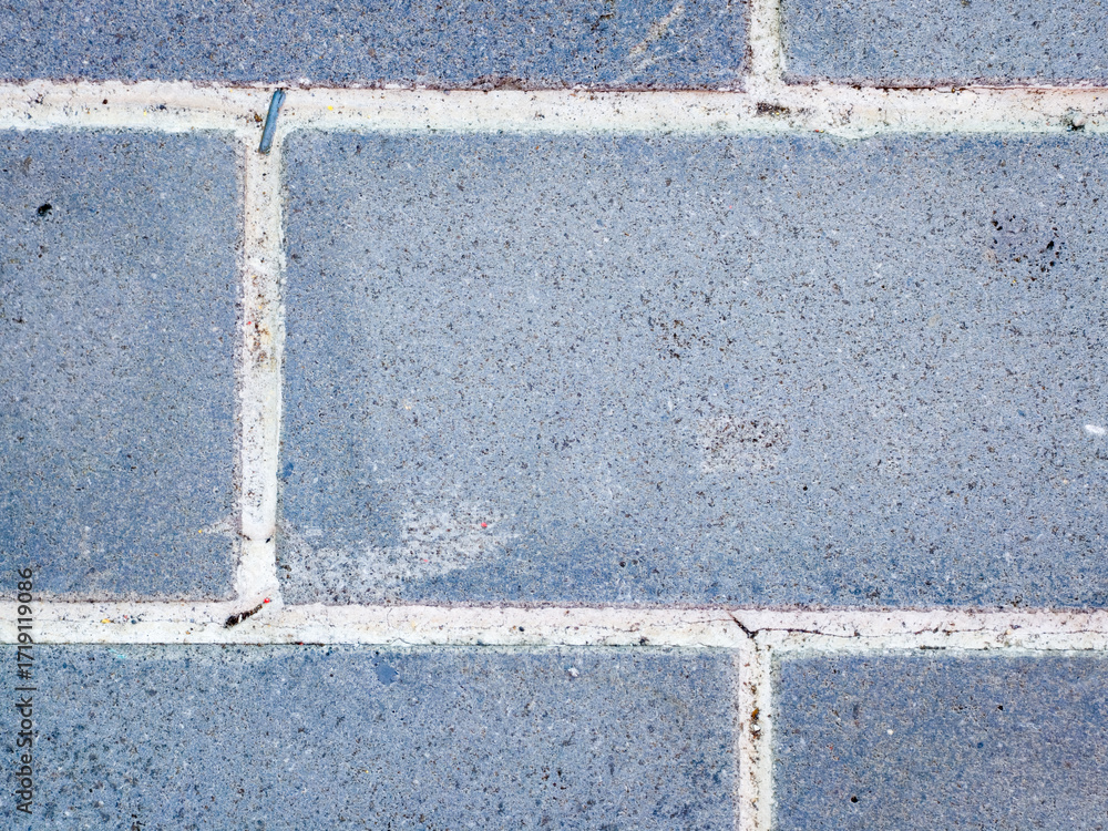 Fototapeta premium Close up of blue brick wall with mortar lines