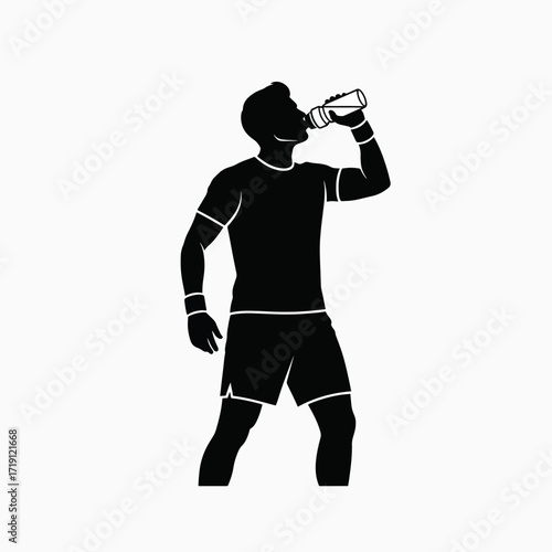 Silhouette of Athletic Man Drinking Water from Bottle After Exercise