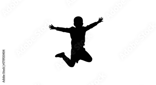 Silhouette of a boy jumping with open arms