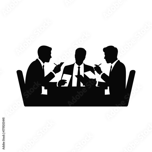 Three business professionals engaged in a serious discussion around a table in silhouette