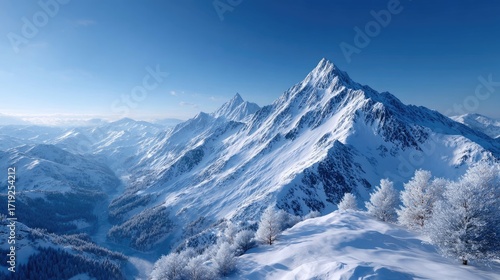 Wallpaper Mural Majestic Snowy Mountain Peaks Under Clear Blue Sky in Winter Aerial View of Mountain Range with Snow Covered Trees in Sunlight Dramatic HDR Landscape Torontodigital.ca