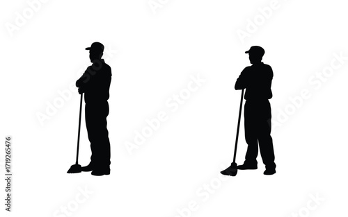 Two silhouetted figures holding brooms standing against a plain white background in a studio