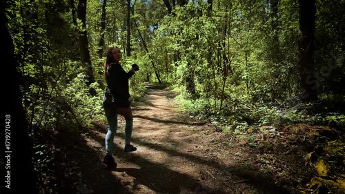 Wallpaper Mural Horrified woman running and looking back in terror from serial killer. Scared female fleeing and glancing behind in panic from maniac. Frightened lady escaping and turning around in fear from murderer Torontodigital.ca
