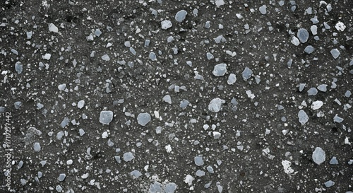 Fototapeta Naklejka Na Ścianę i Meble -  Dark asphalt texture with small stones and pebbles for background or wallpaper use.