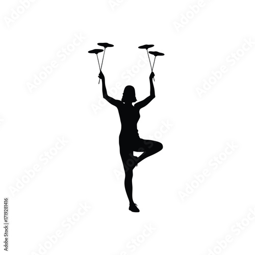 Silhouette of a woman balancing on one leg while spinning plates on sticks above her head
