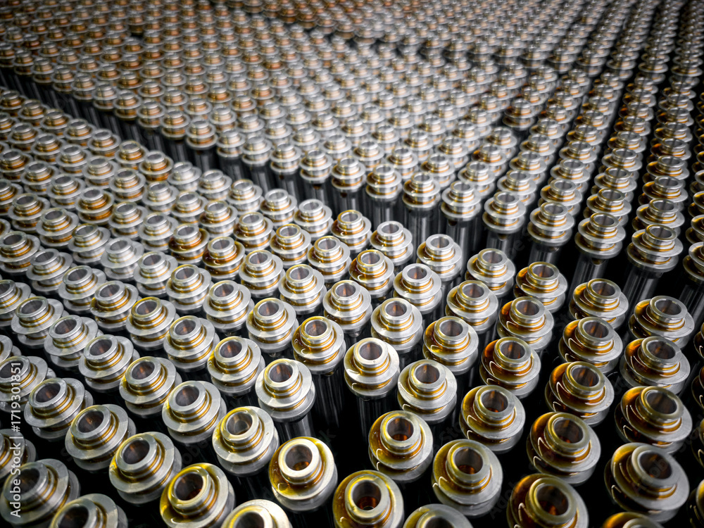 Obraz premium Rows of batteries arranged systematically in a storage facility showcasing their metallic design and uniformity