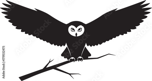 Majestic black owl spreading wings perched on a branch silhouette