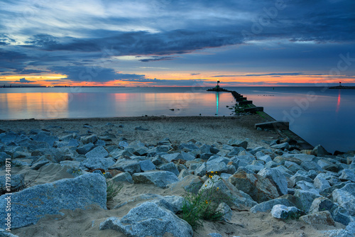 Fototapeta Naklejka Na Ścianę i Meble -  Sunset over the Baltic Sea beach in Gorki Zachodnie, Gdansk. Poland